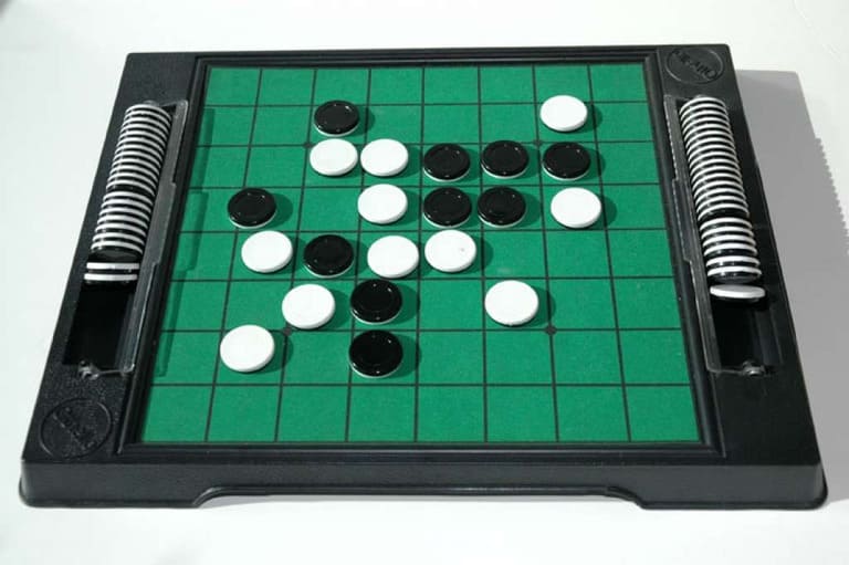Small portable Go board with magnetic black and white stones