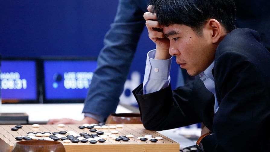 Lee Sedol concentrating at the Go board during a professional match