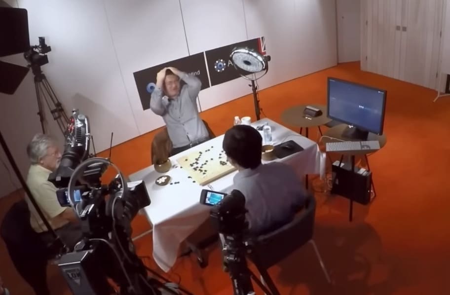 Behind-the-scenes view of analysts reacting during a Fan Hui vs AlphaGo match