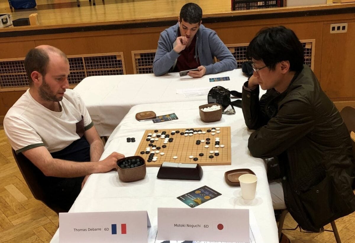 Go tournament game between Thomas Debarre 6d and Motoki Noguchi 6d at a competition table