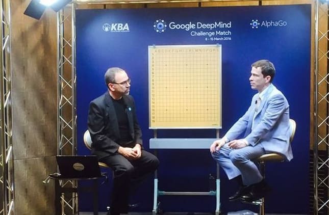 Chris Garlock, left, and Michael Redmond beside a demonstration Go board on the AlphaGo commentary set in Seoul.
