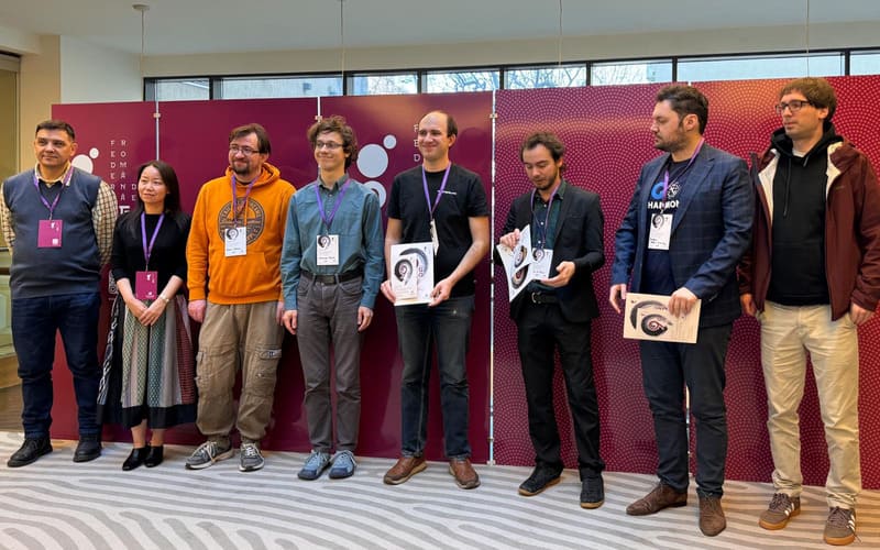 A group of European Go players standing together at a tournament ceremony.