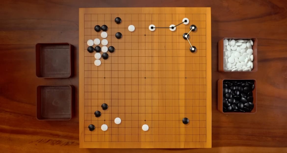Overhead view of a Go board during a match between AlphaGo and Lee Sedol
