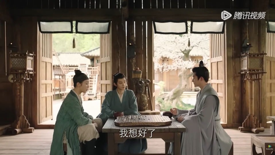 A scene from Lost You Forever showing three characters seated around a Go board inside a traditional wooden hall.
