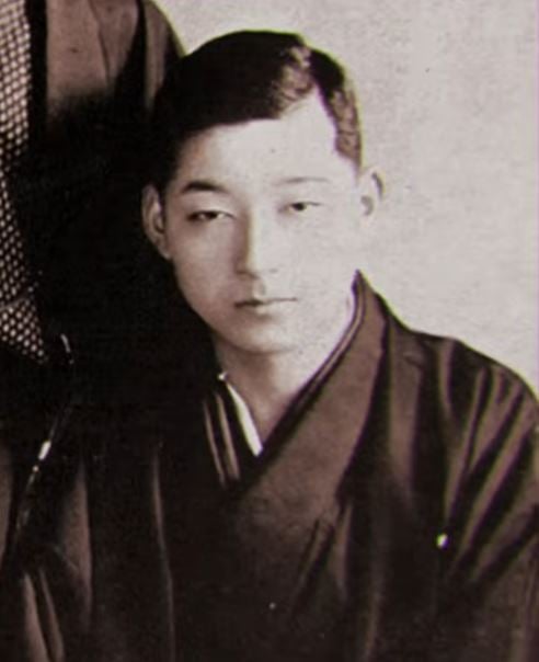 Black-and-white portrait of a young man in traditional Japanese clothing associated with the story of The Go Master.