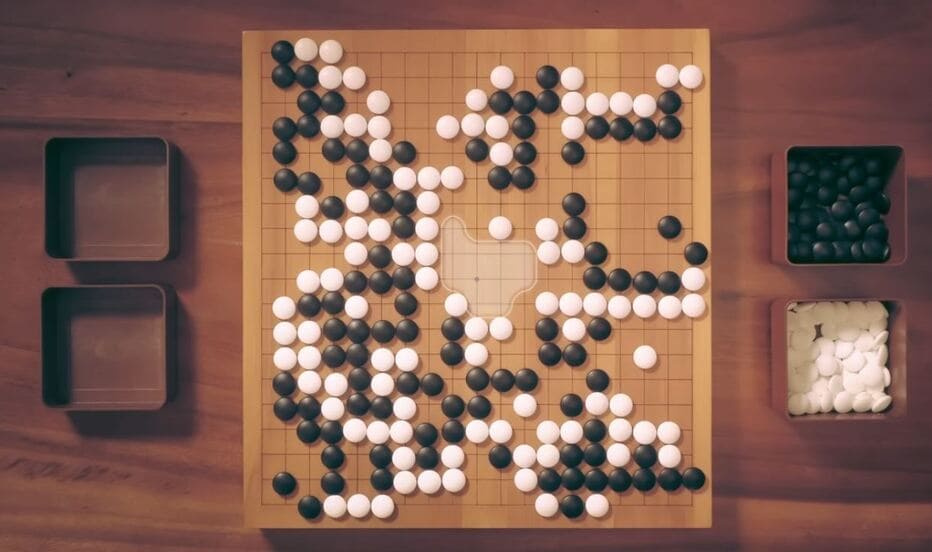 Overhead view of a complex Go board position during the midgame phase