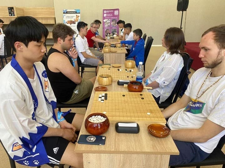 Go players from different countries facing each other in an intense tournament in Kyrgyzstan.