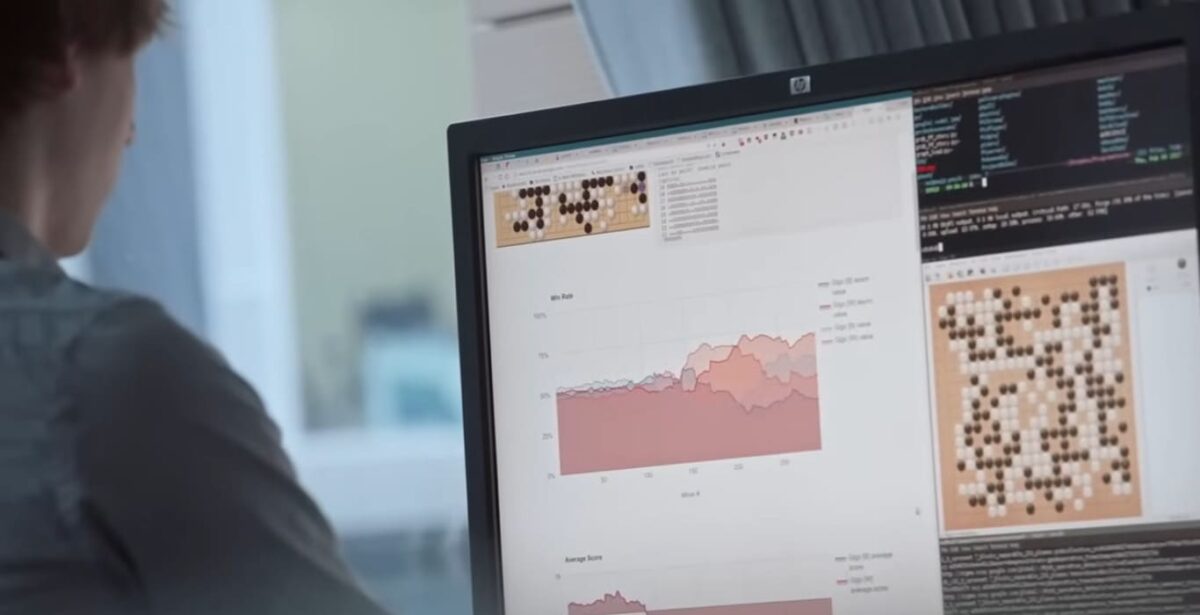 Computer screen displaying AlphaGo analysis with Go board positions and win rate graphs