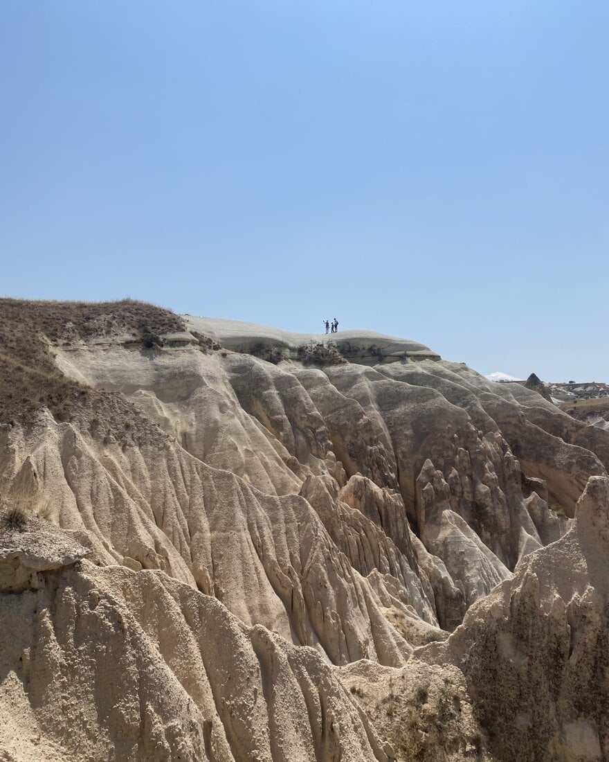 Rocky canyon landscape of Ihlara Valley in central Türkiye under a clear blue sky