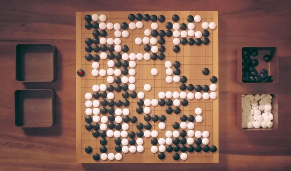 Detailed late-game Go board position with territories nearly settled