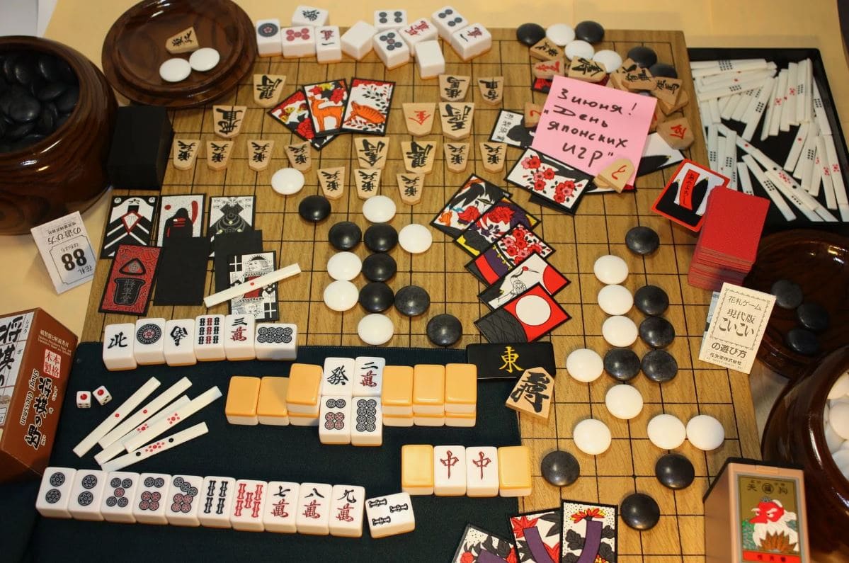 A collection of traditional Japanese board games, including Go, Mahjong, and Hanafuda cards.