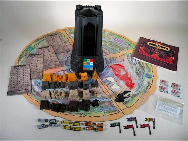 Dark Tower board game displayed with the iconic tower in the center, surrounded by player pieces, flags, and game cards on a fantasy-themed map.