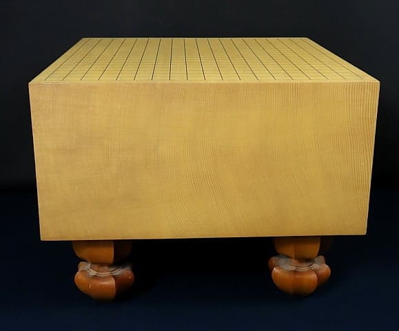 Traditional Go board with wooden legs, crafted from white spruce wood