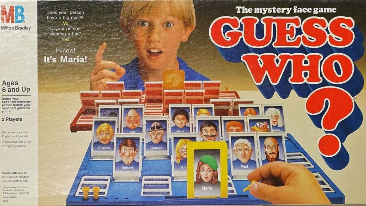 The classic Guess Who game with a boy selecting character cards, featuring cartoonish portraits of characters used for deduction in this mystery face game.