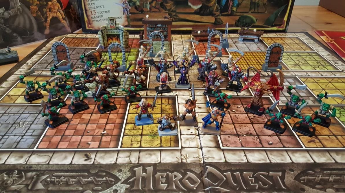 A detailed view of the HeroQuest board game with miniatures of heroes and monsters arranged in a dungeon-like setting, ready for an adventure.