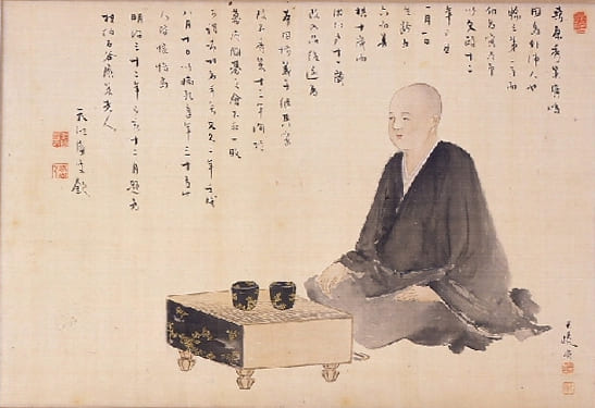 A historic illustration of Honinbo Shusaku, one of the greatest Go players in history, sitting beside a Go board.