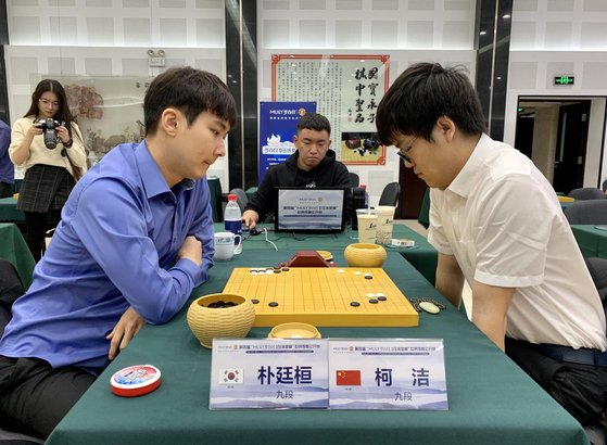 Contemporary Go champions Ke Jie and Park Junghwan play a high-level match, representing modern elite rivalry.