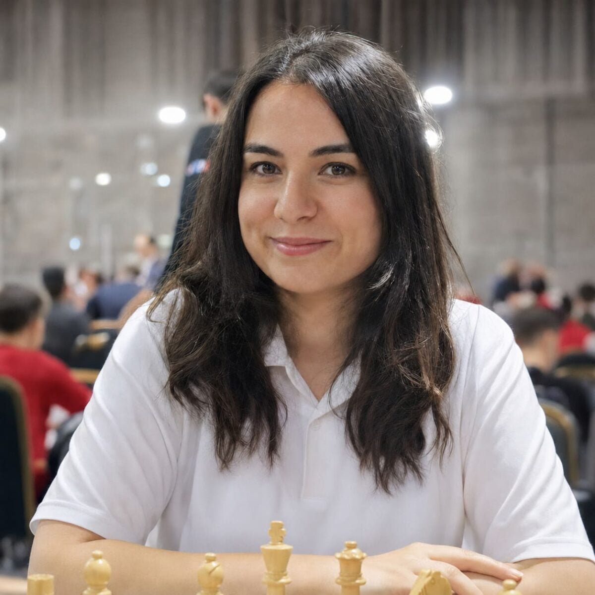 Chess grandmaster Kübra Öztürk Örenli seated at a tournament table