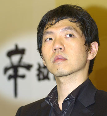 Lee Changho, known as the "Stone Buddha," with a serious expression, attending a professional Go event.