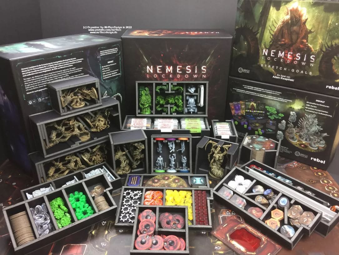 An organized setup of the Nemesis: Lockdown board game with intricate miniatures, tokens, and card decks.