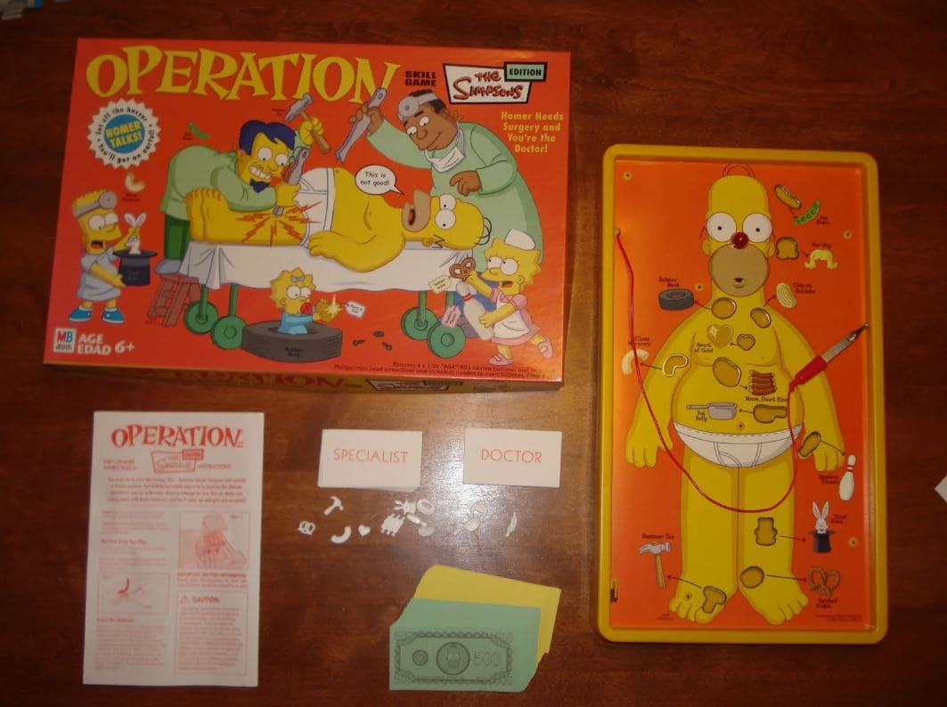 A Simpsons-themed version of the Operation game with Homer Simpson as the patient, complete with the game's pieces and dollar bills.