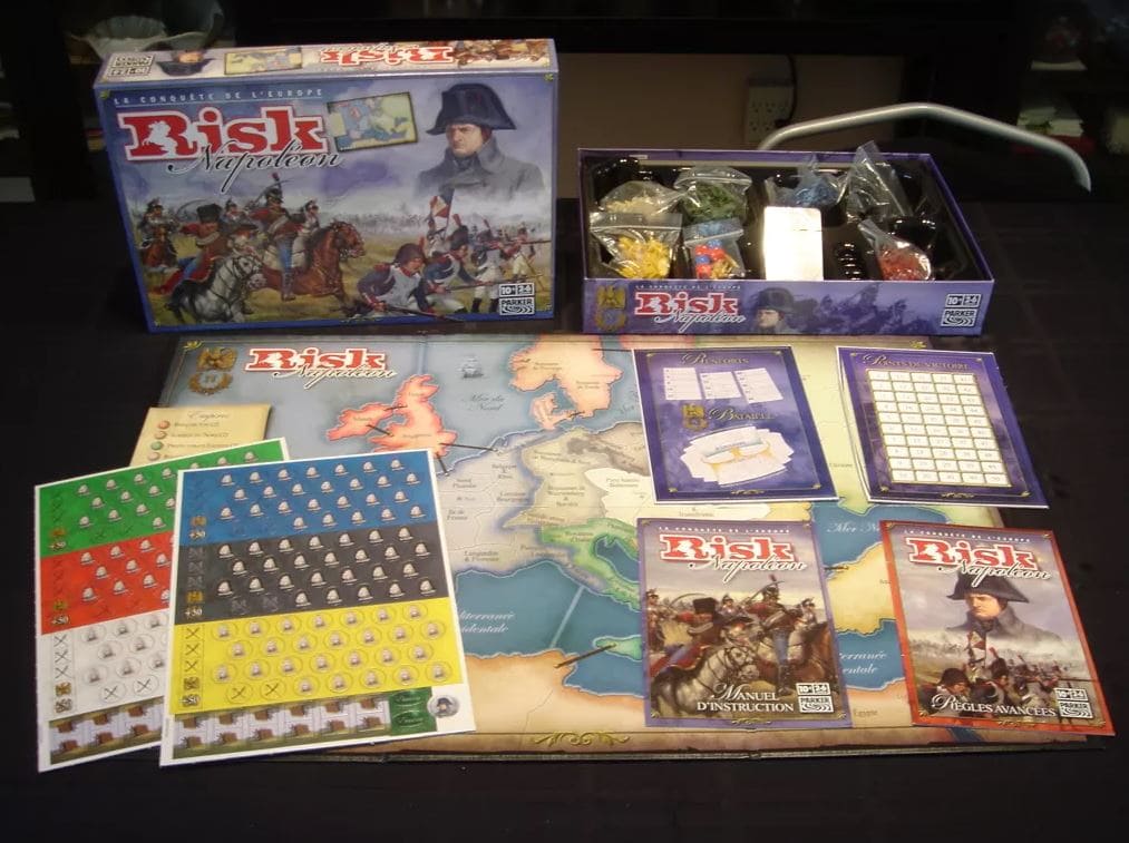 A Napoleon edition of the classic Risk board game from the 1990s, showing maps, instruction booklets, and game pieces.