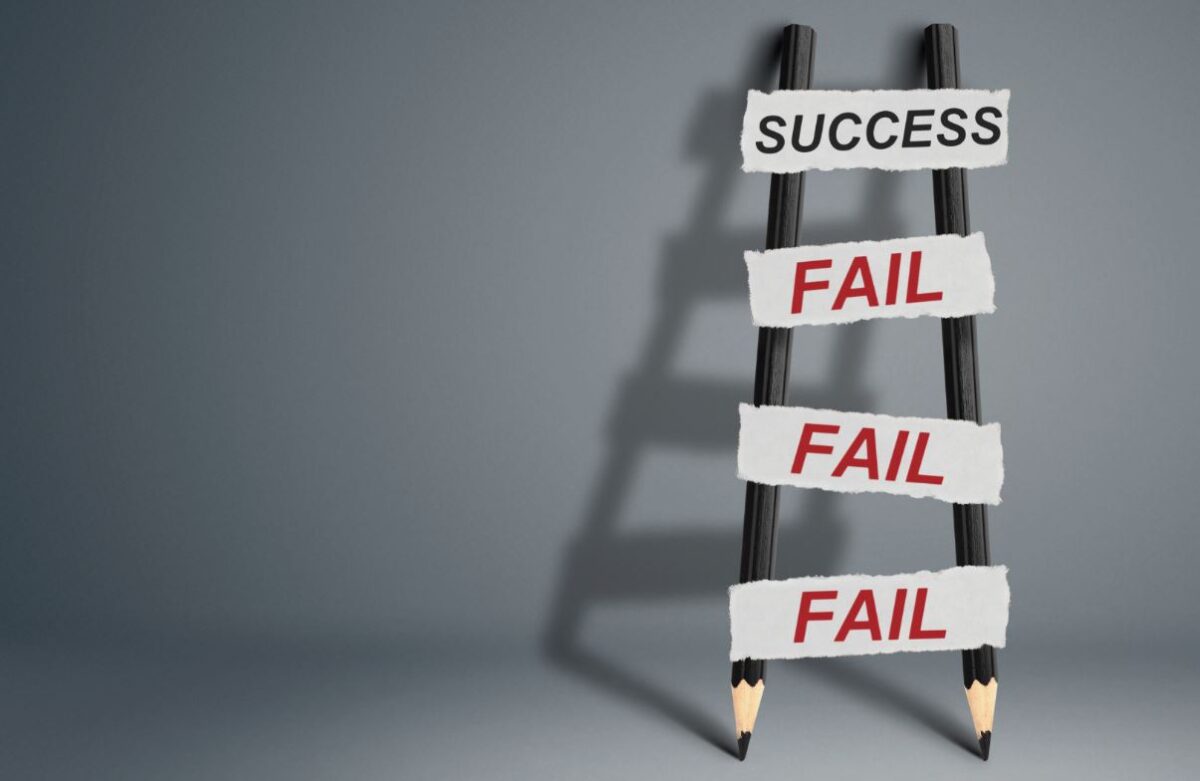 A ladder made of pencils with "Fail" written on each step leading up to "Success", symbolizing the importance of failures on the path to achievement.