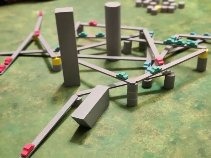 The Tokyo Highway board game featuring intricate road and pillar constructions with tiny cars.