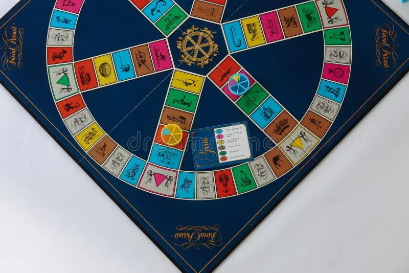 Trivial Pursuit board game with a blue circular board and question categories, a popular trivia game from the 80s.