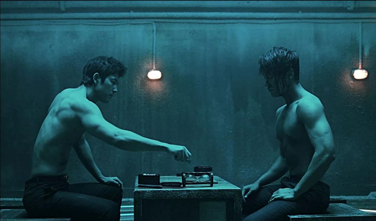 An iconic scene from The Divine Move showcasing a high-stakes Go match between two characters in a dimly lit, tense atmosphere, highlighting the physical and psychological duel of the players.